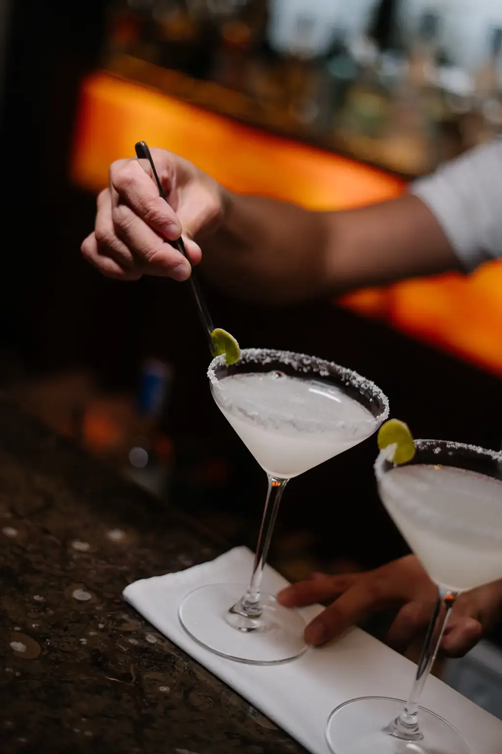 Bartender stirring a cocktail at the DNA Bar