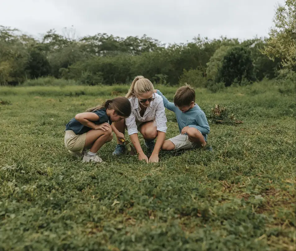 Family discovering nature near the lodge