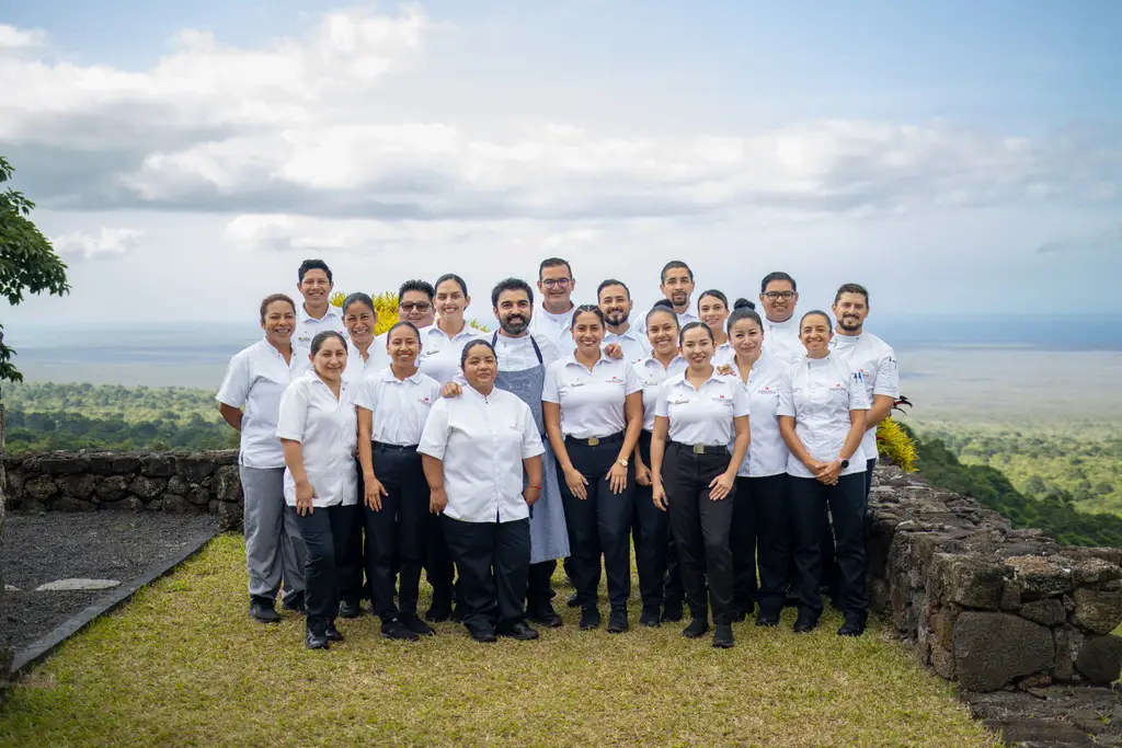 Pikaia Lodge team gathered at the lodge entrance