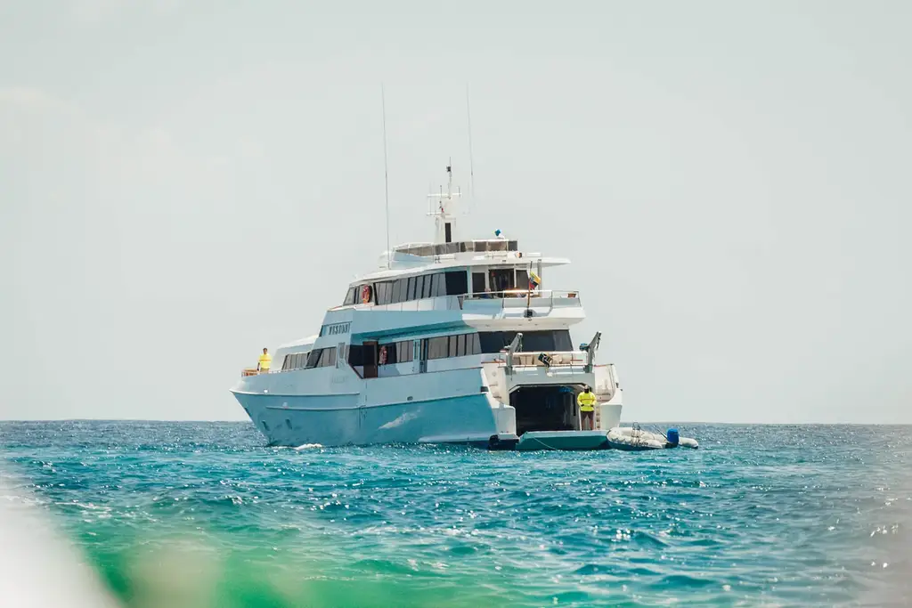 Guests exploring a Galápagos island from the yacht