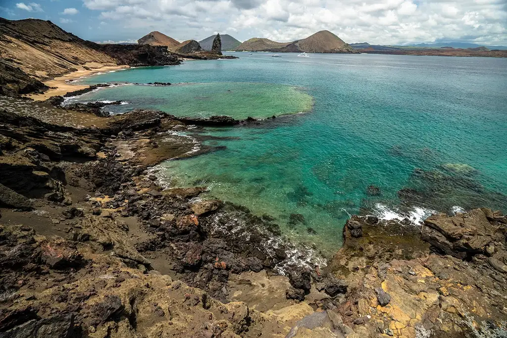 Volcanic Galápagos coastline seen from the yacht